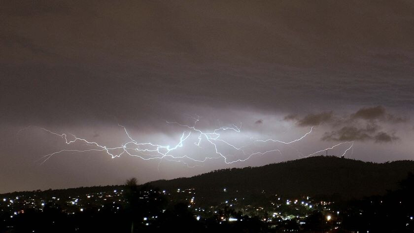 Lightning criss-crosses the sky above Brisbane during a storm overnight.