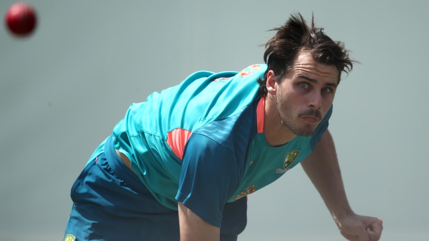 An Australian male fast bowler bowls in the SCG nets.