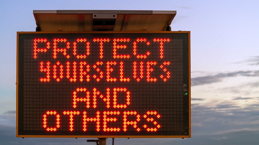 Social distancing banner installed in Adelaide, which reads: "Protect yourselves and others".