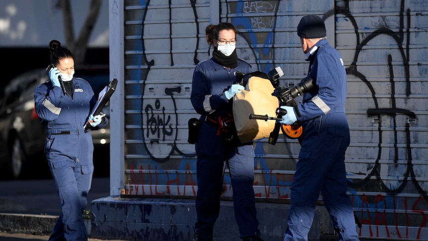 Victoria Police Forensic unit work at the scene where a man was stabbed to death by a woman in Abbotsford.