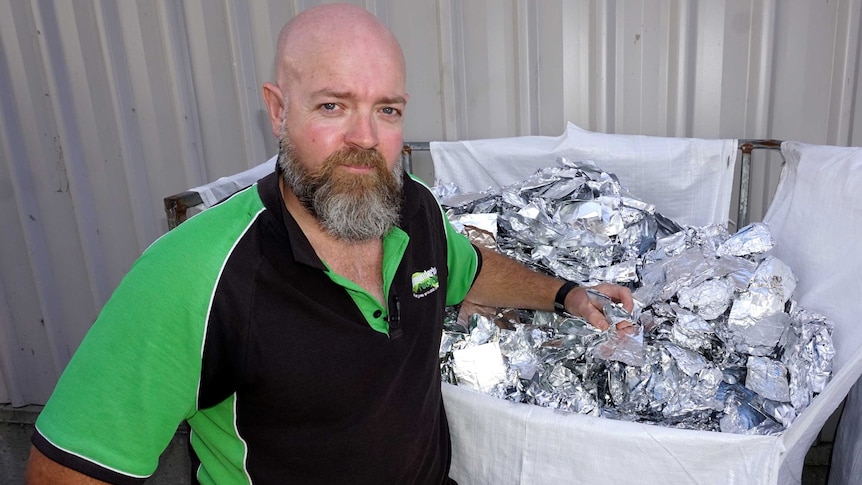 Gerrard McClafferty standing next to a big bag full of foil