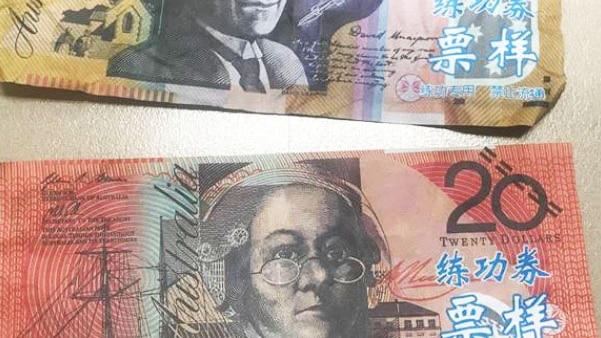 Chinese characters are clearly visible on what otherwise look like Australian bank notes.