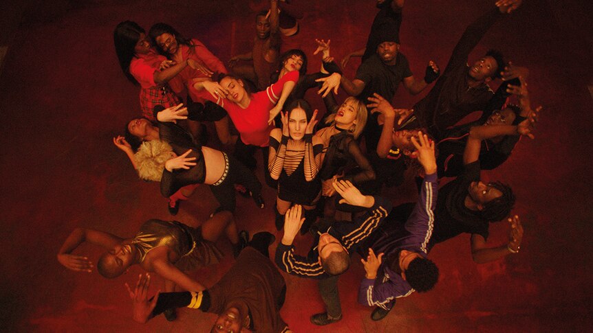 Colour still aerial view of group dance scene from 2018 film Climax.