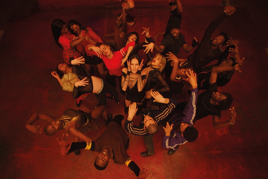 Colour still aerial view of group dance scene from 2018 film Climax.