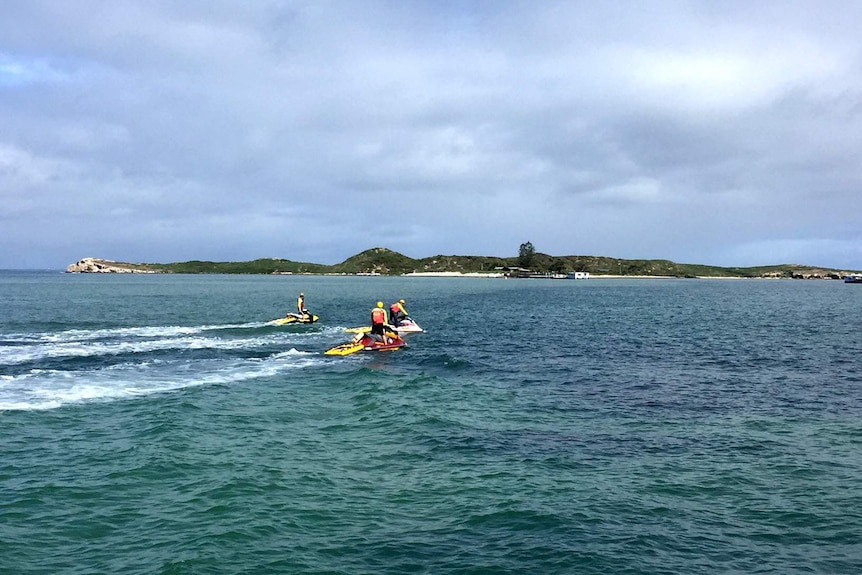 Three men on jet skis search for a man missing since yesterday.