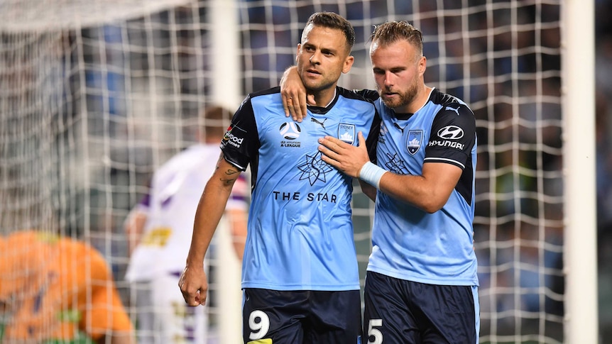 Bobo (L) celebrates his penalty scored for Sydney FC against Perth Glory.