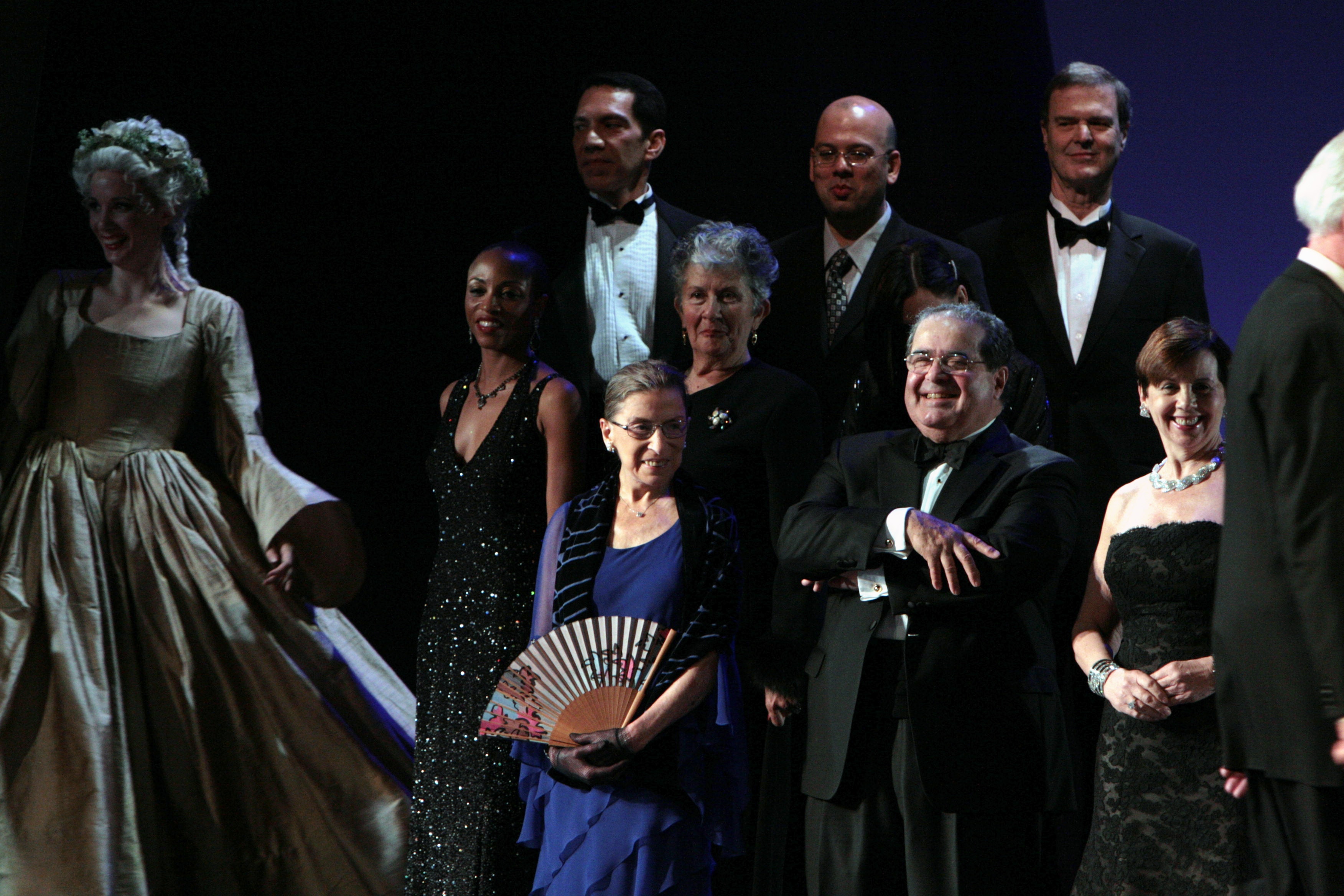A line up of people in formal attire.