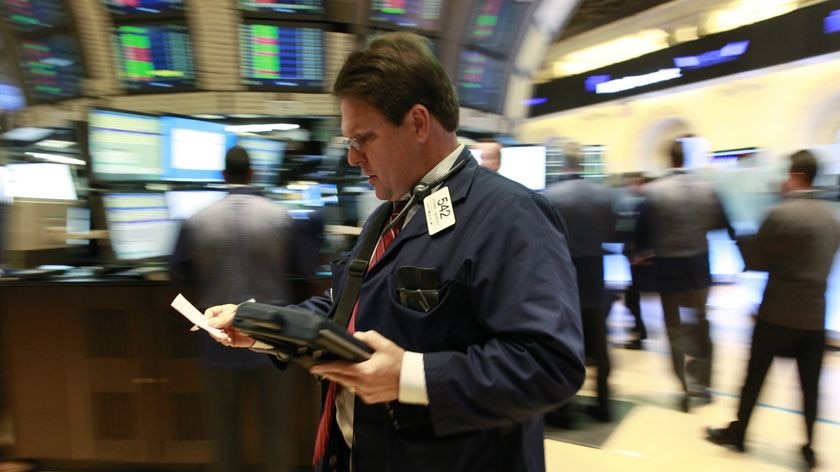 Traders work on the floor of the New York Stock Exchange