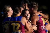 Alexandra Anderson of the Lions celebrates with team mates during AFLW match