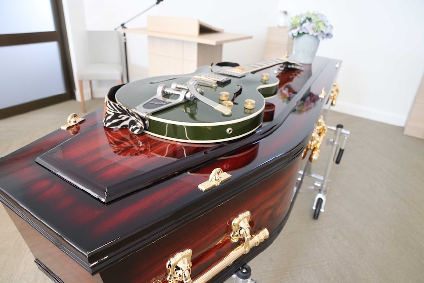 A guitar on a coffin