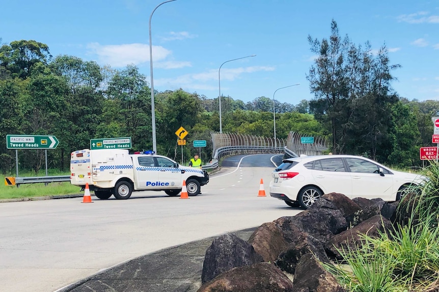 Policemen close off Pacific Highway to traffic after accident.