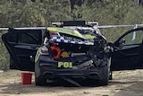 A police car with its boot smashed after a collision. 