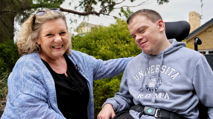 Sandy Guy poses with her son Liam who is in a wheelchair.
