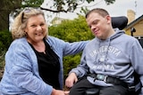 Sandy Guy poses with her son Liam who is in a wheelchair.