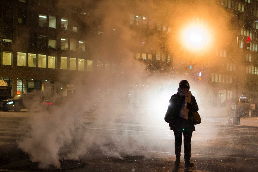 Woman walks through steam in Washington