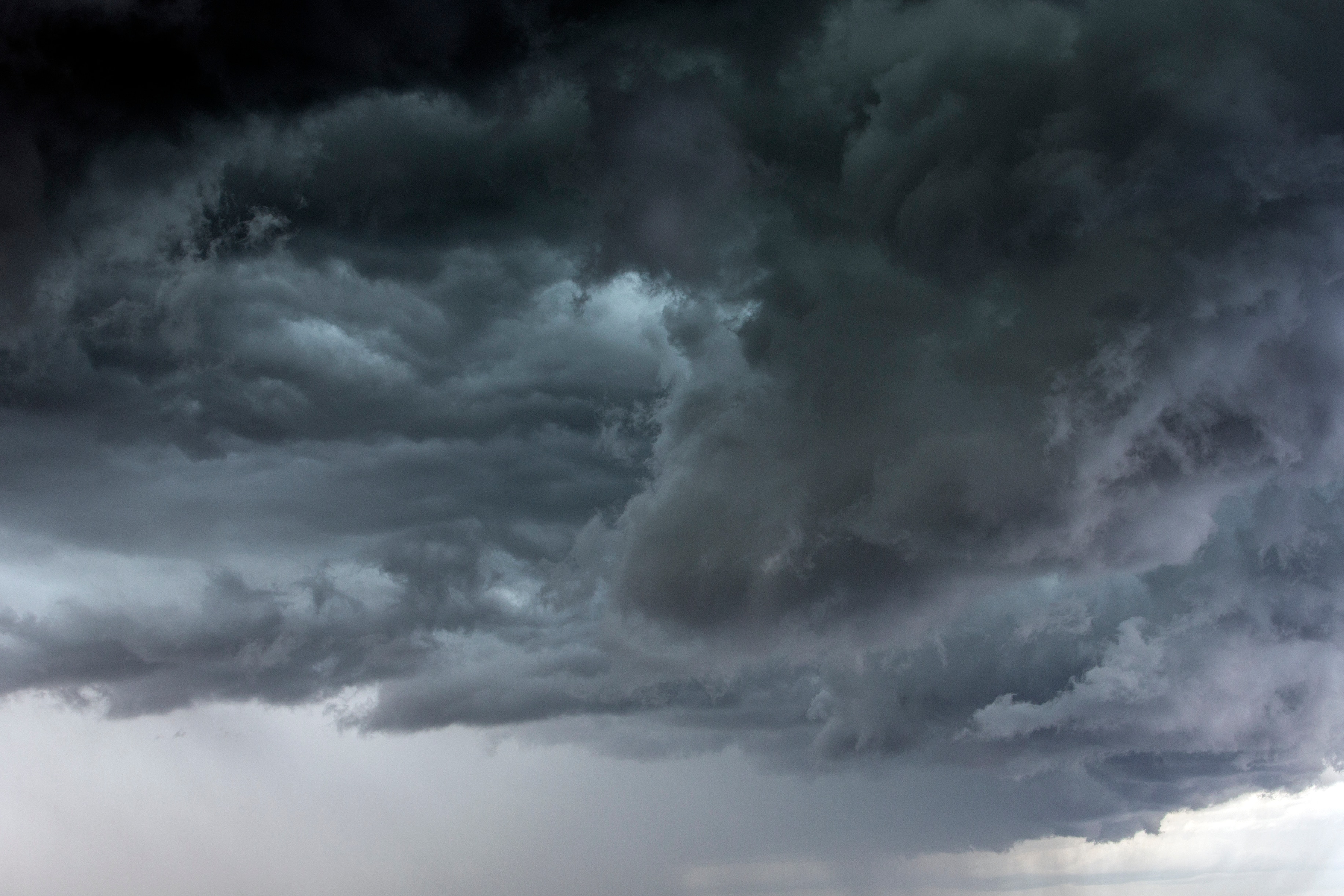 Image of dark, ominous storm clouds in the sky. 