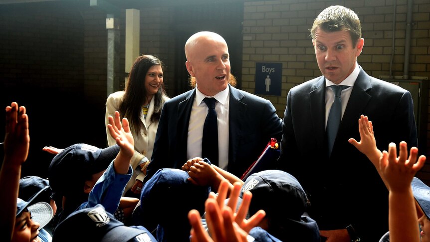 New South Wales Premier Mike Baird (right) and Minister for Education Adrian Piccoli in a crowd of students