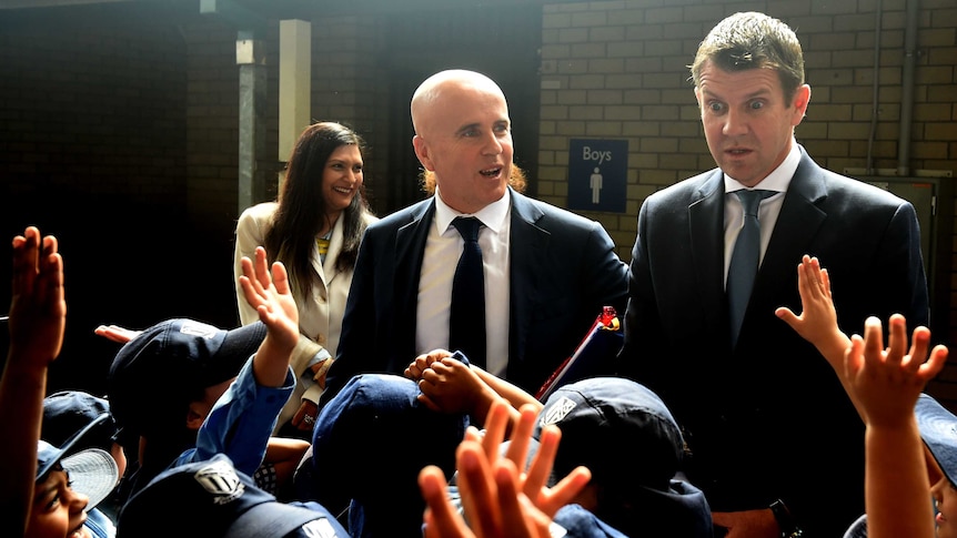 New South Wales Premier Mike Baird (right) and Minister for Education Adrian Piccoli in a crowd of students