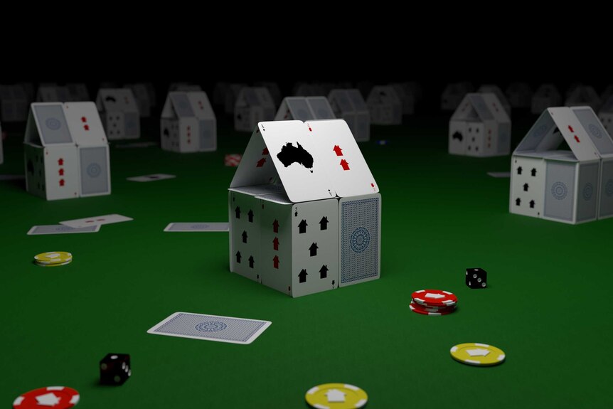 Image of little houses made from playing cards.