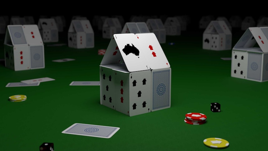 Image of little houses made from playing cards.