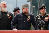 A bearded man in a traditional Chechen hat 