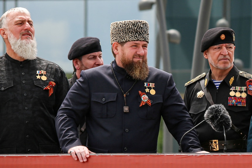 A bearded man in a traditional Chechen hat 