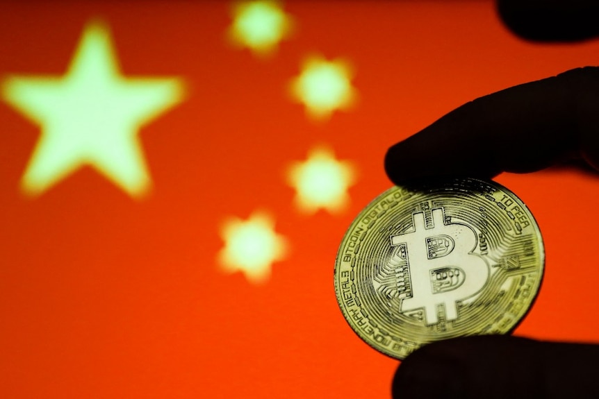 Representation of the Bitcoin cryptocurrency is seen with Chinese flag in the background.