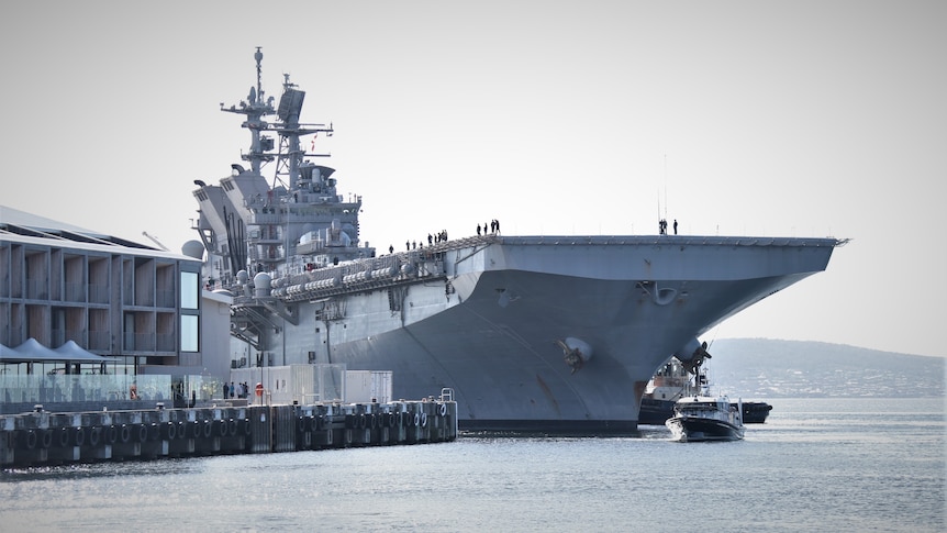 USS Tripoli docked in Hobart.