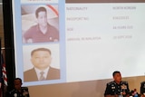 Police display a picture of suspect Hyon Kwang Song on a projector.
