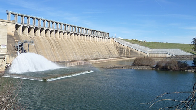 A dam with a concrete spillway