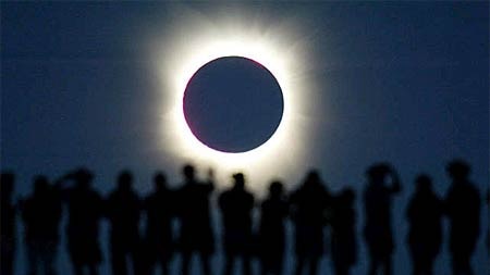 Tourists watch a total eclipse in the Australian outback in December 2002.