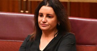 Jacqui Lambie sits in the senate after resigning over dual citizenship.