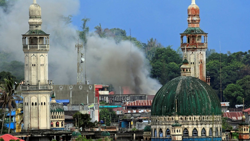 Smoke billows are seen as government troops continue their assault against insurgents in Marawi.