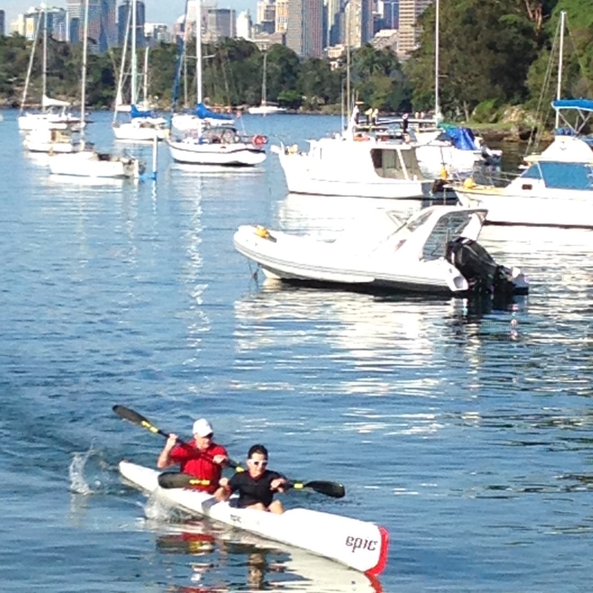 Kate Carnell paddles in a kayak with her husband