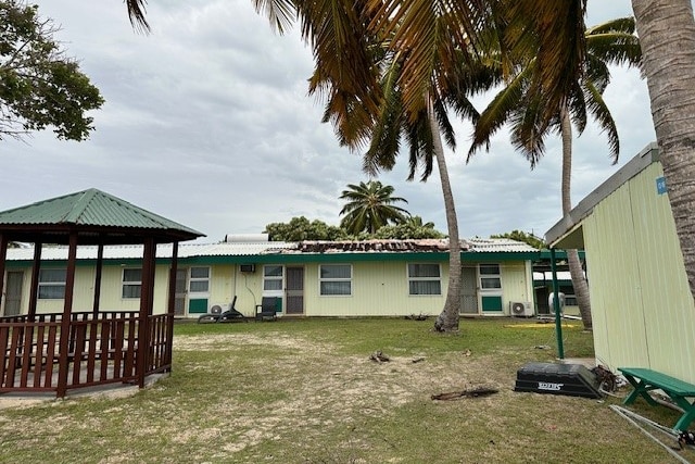 The Cocos Beach Hotel with a damaged roof, in front of stormy skies. 