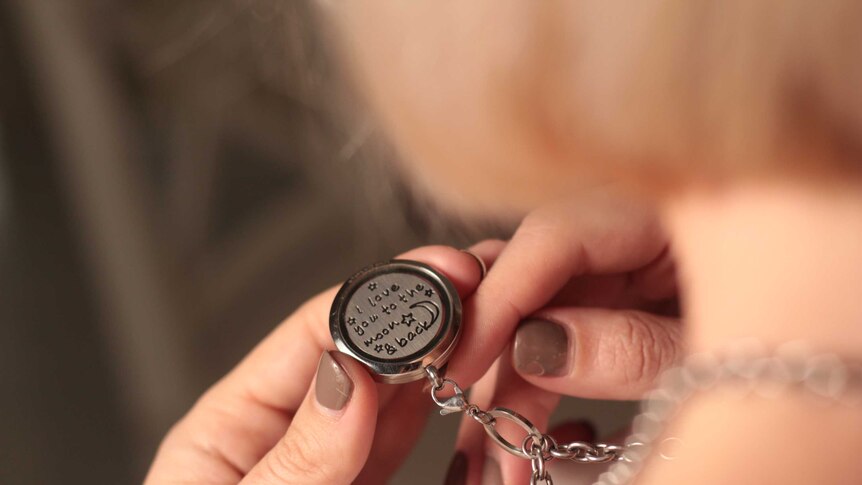Sally Faulkner holds a locket