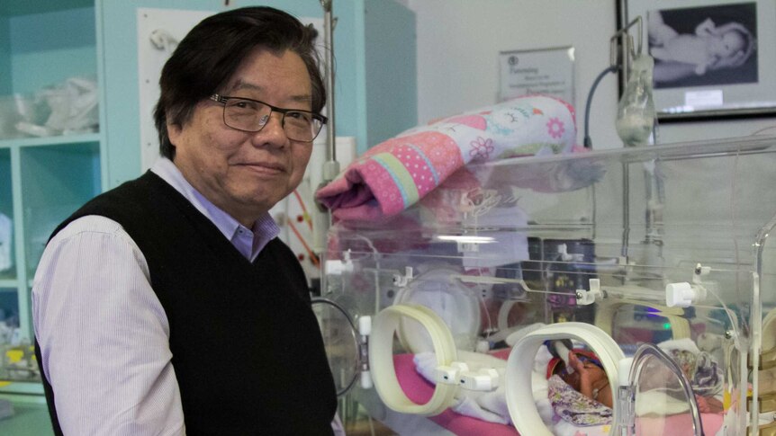 Professor Kei Lui with a premature baby in the Royal Hospital for Women intensive care unit