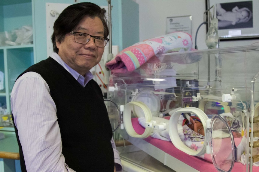 Professor Kei Lui with a premature baby in the Royal Hospital for Women intensive care unit