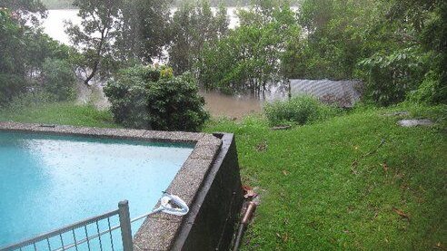 Floodwaters approach a property