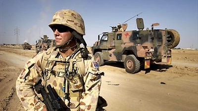 An Australian soldier patrols in Iraq