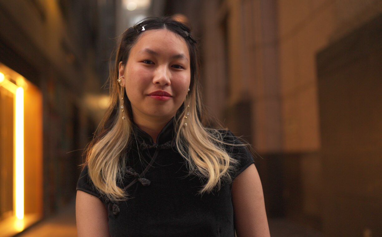 A young person in a cheongsam