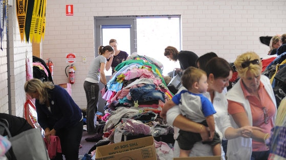 Relief effort: Bushfire victims look for new clothes at the Whittlesea Community Activity Centre north of Melbourne.