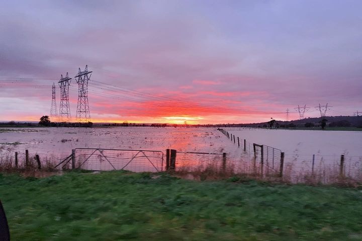 Sun rising over flood water at Trafalgar 