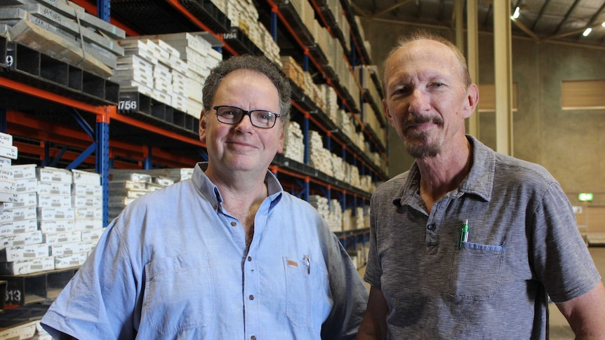 Rick Valenta and Paul Donchack in their huge warehouse