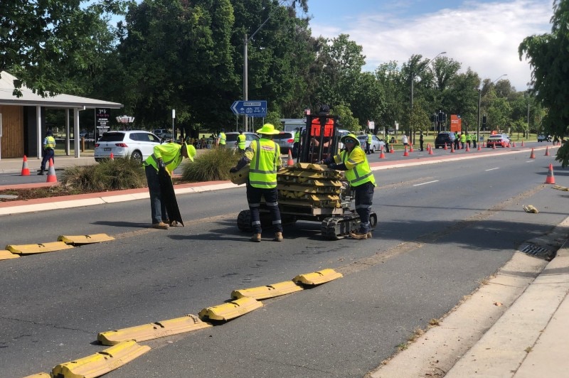 Crews removing traffic guides on Sunday morning at Albury.