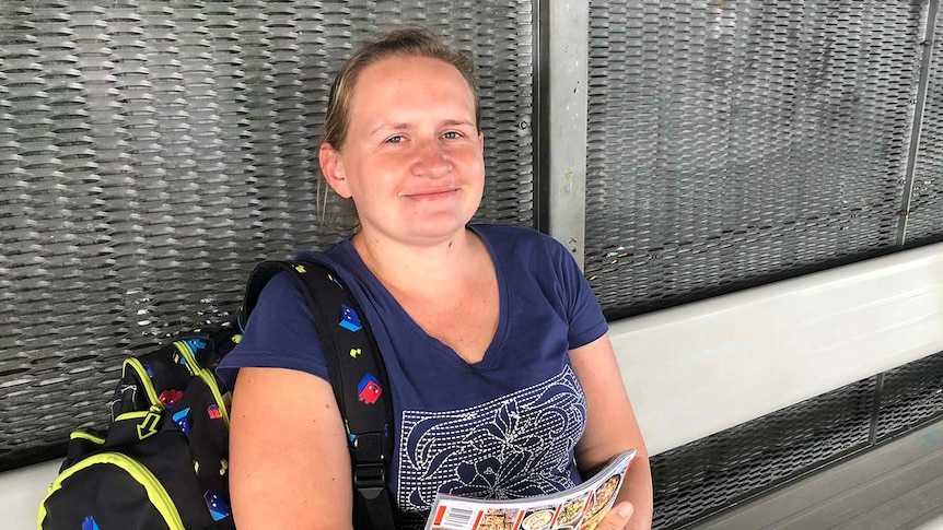 Commuter Poula Zychora waits for a train at Beenleigh train station, south of Brisbane on February 4, 2018.