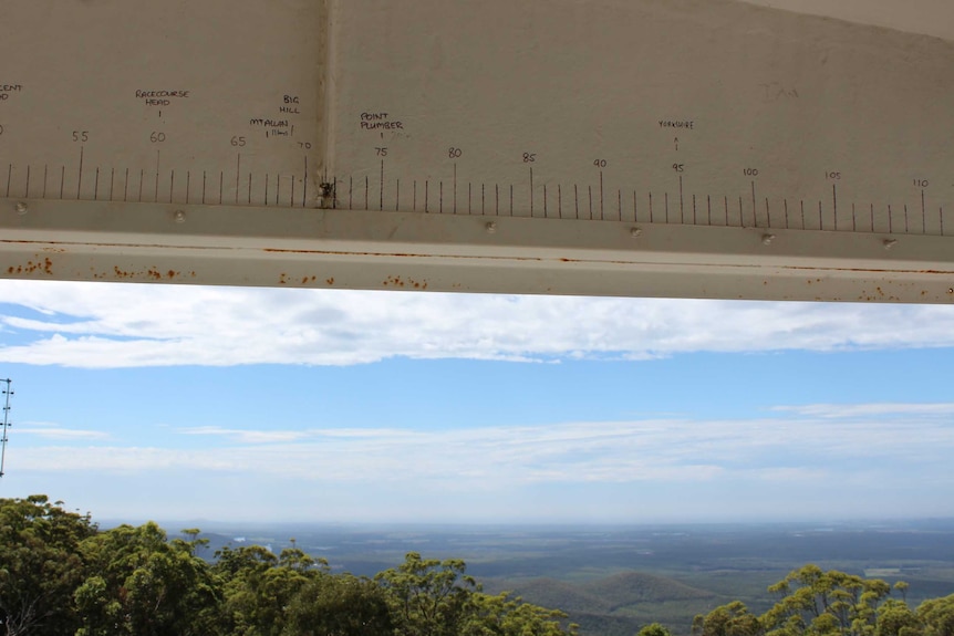 Lines and numbers marked on the ceiling of a fire tower.