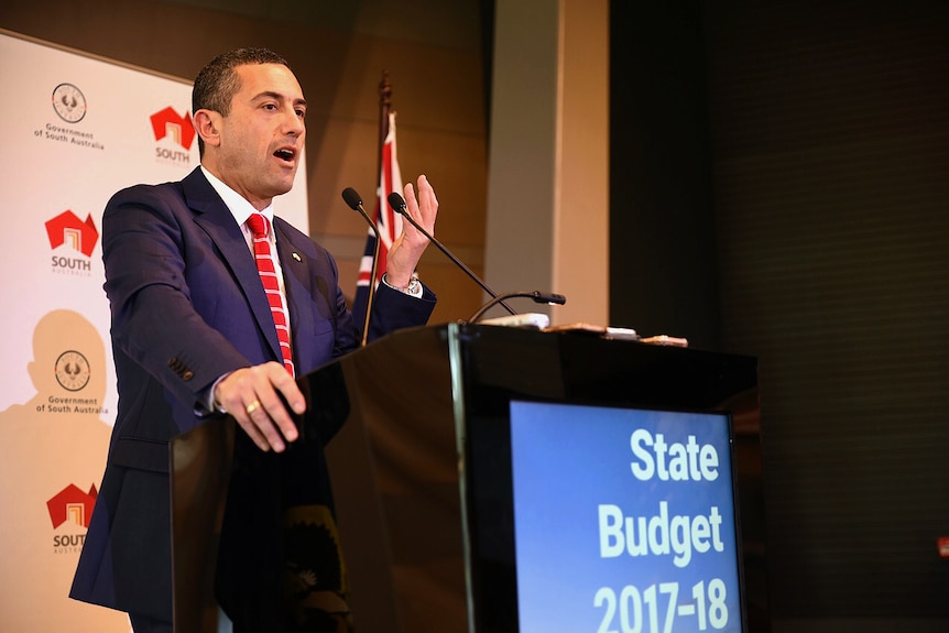 Treasurer Tom Koutsantonis speaks from behind a Government podium.