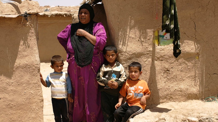 A woman and her family in Mosul