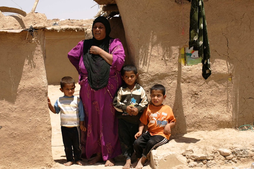 A woman and her family in Mosul